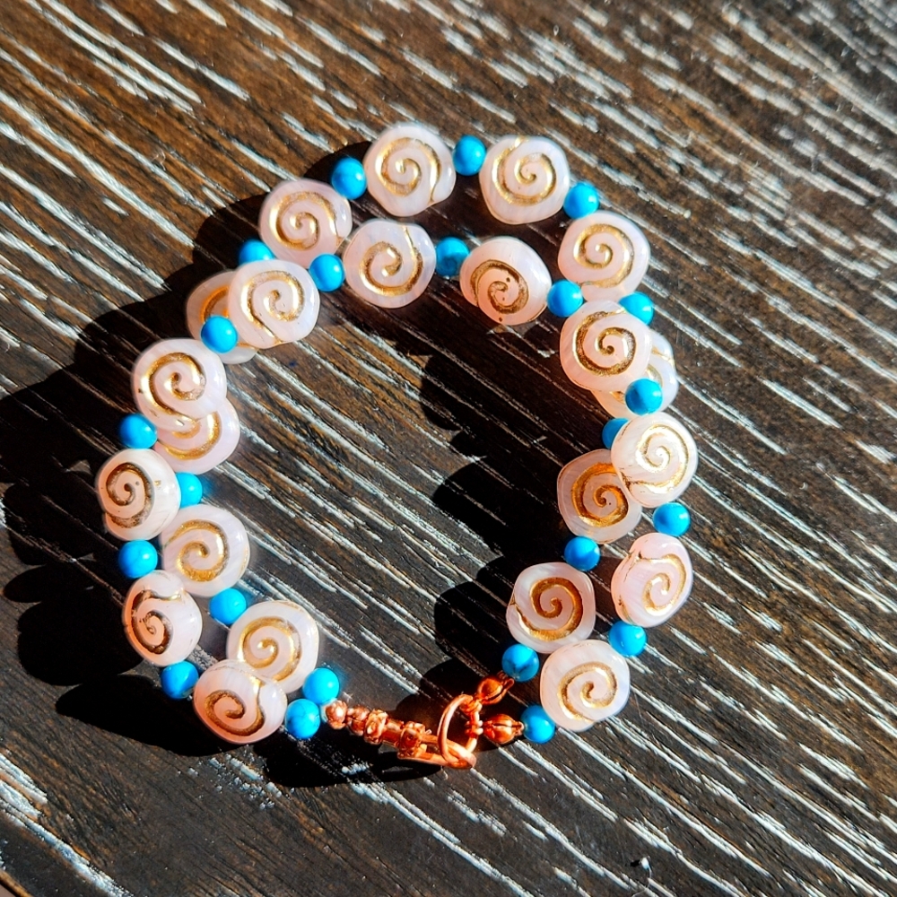 Handmade bohemian bracelet real copper, magnisite, and spiral beads.